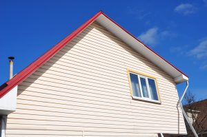 Big house with cream polymer siding.